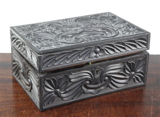 A 19th century Ceylonese carved ebony work box, 9.25in.